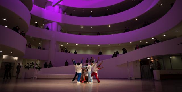 In the Guggenheim, with it's infamous spiral interior leading to the top floor, dancers perform on the ground level.