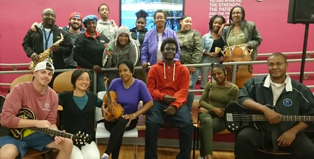 Shaw Pong Liu poses with some students and their instruments.