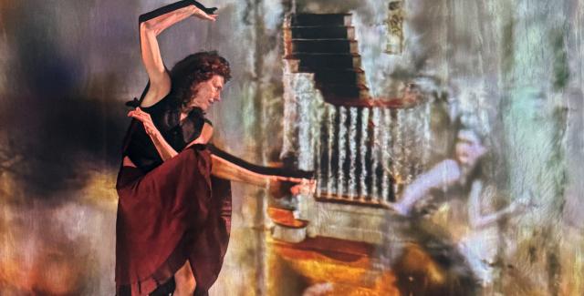 A performer in a red skirt and black top strikes a post.