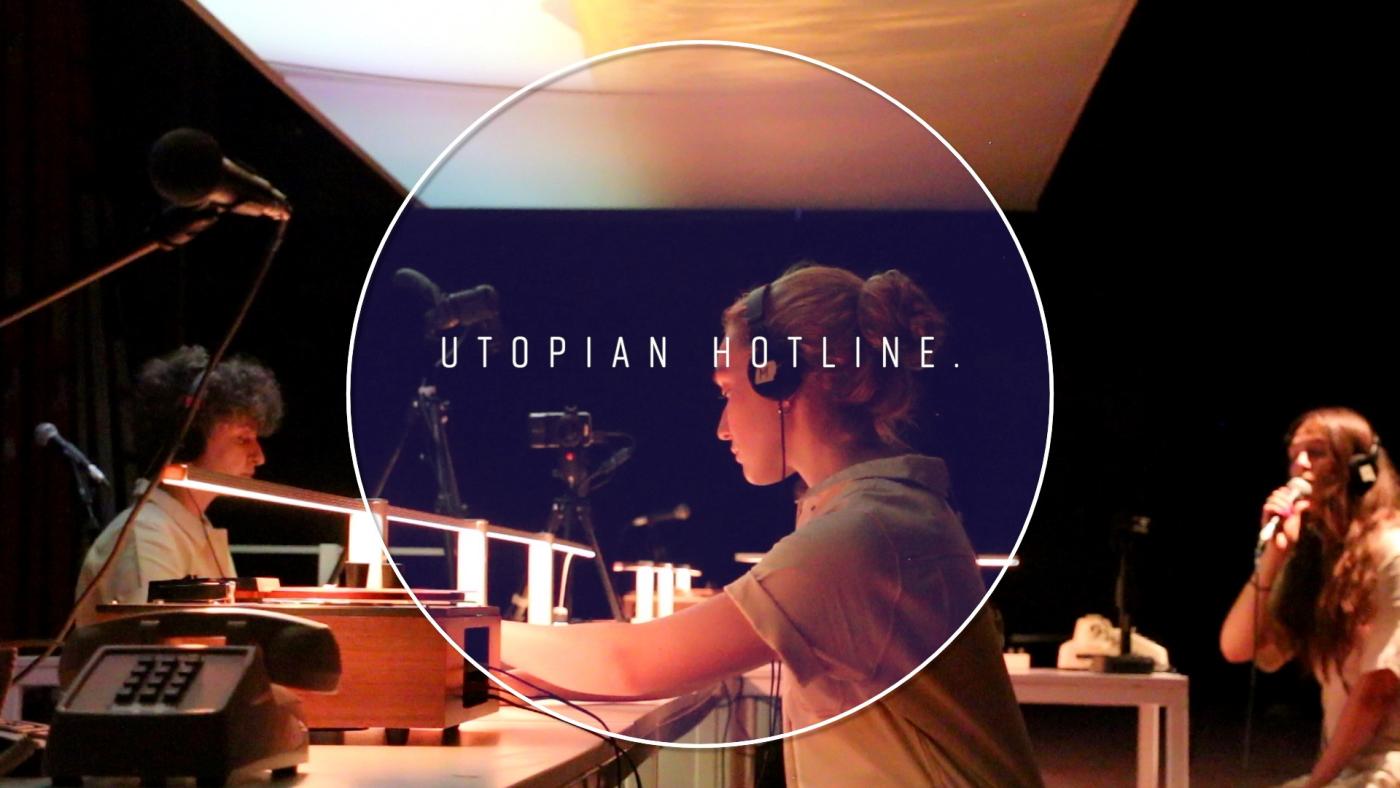 At desks, three folks wear headsets and are mic'ed. Over the image: a circular frame with "Utopian Hotline" in the center.