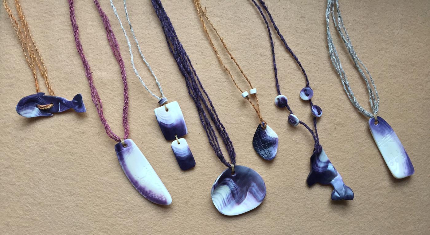 Wampum necklaces with varying stones.