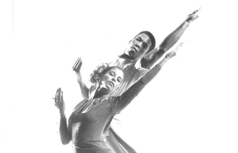 Black and white image of a couple dancing in a white void.