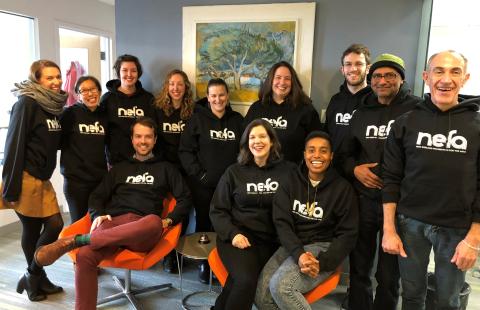 NEFA staff wearing sweatshirts with the NEFA logo