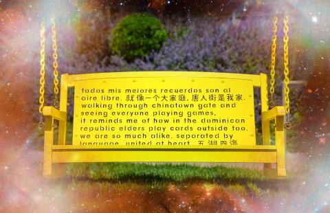 In a red galaxy, a yellow swing with English, Spanish, and Chinese characters carved into the back.
