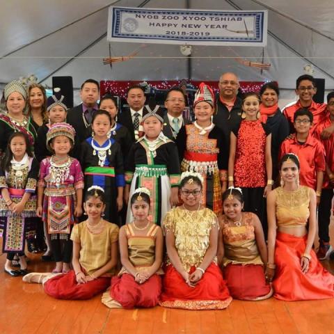 Dancers from Hmong United Association of Rhode Island and India Association of Rhode Island pose together after performing