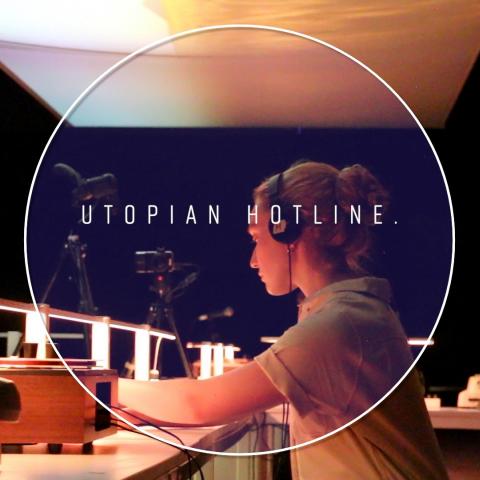 At desks, three folks wear headsets and are mic'ed. Over the image: a circular frame with "Utopian Hotline" in the center.