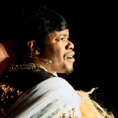 Close up of Jaamil's face on stage.