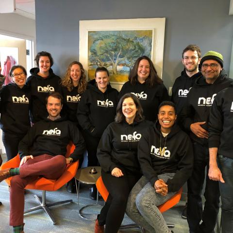 NEFA staff wearing sweatshirts with the NEFA logo